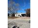 Single-story home with a brick driveway and mature tree at 200 175Th E Ave, Redington Shores, FL 33708