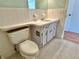 Neat bathroom with toilet and vanity with under-sink storage at 2284 Philippine Dr # 9, Clearwater, FL 33763