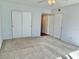Bright bedroom featuring double closets and wall-to-wall carpet at 2284 Philippine Dr # 9, Clearwater, FL 33763