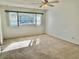 Bedroom with a large window, offering plenty of natural light at 2284 Philippine Dr # 9, Clearwater, FL 33763