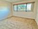 Bright bedroom with large window and view of the outdoors at 2284 Philippine Dr # 9, Clearwater, FL 33763