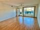 Spacious living room with hardwood floors and large window at 2284 Philippine Dr # 9, Clearwater, FL 33763
