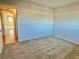 Spacious bedroom with light-colored walls and carpeted floors at 2284 Philippine Dr # 9, Clearwater, FL 33763