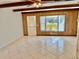 Living area with tile floors and wood beams at 2284 Philippine Dr # 9, Clearwater, FL 33763