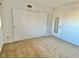 Bedroom with three-door closet and neutral carpeting at 2284 Philippine Dr # 9, Clearwater, FL 33763