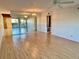 Bright living room featuring hardwood floors and a large mirror at 2284 Philippine Dr # 9, Clearwater, FL 33763