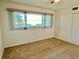 Spacious bedroom with a large window and ample natural light at 2284 Philippine Dr # 9, Clearwater, FL 33763
