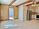 Open living space with tile floor and kitchen access at 2284 Philippine Dr # 9, Clearwater, FL 33763