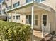 Neat landscaping with covered patio and white picket fence at 2284 Philippine Dr # 9, Clearwater, FL 33763
