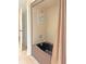 Brown bathtub with shower in a tiled bathroom at 2460 W Marion Ave, Punta Gorda, FL 33950