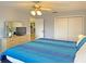 King size bed in bright bedroom with access to kitchen at 2460 W Marion Ave, Punta Gorda, FL 33950