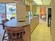 Kitchen with breakfast bar and access to dining area at 2460 W Marion Ave, Punta Gorda, FL 33950