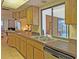 Kitchen with double sink and dishwasher at 2460 W Marion Ave, Punta Gorda, FL 33950