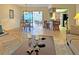 Open living room showcasing a comfortable seating area and view into the kitchen and dining area at 2460 W Marion Ave, Punta Gorda, FL 33950