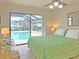 Main bedroom with sliding doors leading to the pool area at 2460 W Marion Ave, Punta Gorda, FL 33950