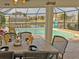 Outdoor dining area with canal and pool view at 2460 W Marion Ave, Punta Gorda, FL 33950