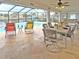Relaxing pool area with patio furniture and canal view at 2460 W Marion Ave, Punta Gorda, FL 33950