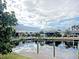 Scenic canal-front view with neighboring homes at 2460 W Marion Ave, Punta Gorda, FL 33950