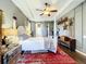 Primary bedroom with a rustic feel, featuring a large bed and a ceiling fan at 2915 126Th E Ter, Parrish, FL 34219