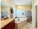 Bathroom with a large garden tub and double vanities at 2915 126Th E Ter, Parrish, FL 34219