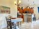 Kitchen features island, wood cabinets, and breakfast nook at 2915 126Th E Ter, Parrish, FL 34219