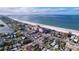 Aerial view of property near beach and pink hotel at 3505 Casablanca Ave, St Pete Beach, FL 33706