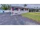 One-story home with a landscaped yard and a paved driveway at 3505 Casablanca Ave, St Pete Beach, FL 33706