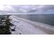 Aerial view of beach, showcasing shoreline and ocean at 3505 Casablanca Ave, St Pete Beach, FL 33706