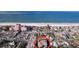 Aerial view of a house near the beach, with a pink hotel visible in the distance at 3505 Casablanca Ave, St Pete Beach, FL 33706