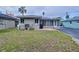 Large backyard with patio, grill, and mature landscaping at 3505 Casablanca Ave, St Pete Beach, FL 33706