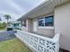 Whitewashed house exterior with a unique patterned railing at 3505 Casablanca Ave, St Pete Beach, FL 33706