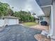 Detached single car garage with a large grassy area beside it at 3505 Casablanca Ave, St Pete Beach, FL 33706