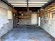 The detached garage is ready for storage; it includes shelving, a ceiling fan, and ample floor space at 3505 Casablanca Ave, St Pete Beach, FL 33706
