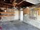 The detached garage features a ceiling fan, functional shelving, and an open layout, ready for use at 3505 Casablanca Ave, St Pete Beach, FL 33706