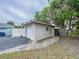 Detached garage with flagstone pathway and a fenced yard at 3505 Casablanca Ave, St Pete Beach, FL 33706