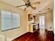 Simple kitchen with wood cabinets and wood floors at 3505 Casablanca Ave, St Pete Beach, FL 33706