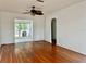 Bright living room featuring hardwood floors and a view of the backyard at 3505 Casablanca Ave, St Pete Beach, FL 33706