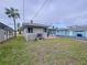 Spacious backyard with a patio and plenty of green space at 3505 Casablanca Ave, St Pete Beach, FL 33706