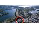 Aerial view of a house near the water, with a bridge visible in the distance at 3505 Casablanca Ave, St Pete Beach, FL 33706