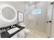Modern bathroom with frameless shower, floating vanity, and LED mirror at 4675 Hickory Oak Dr, Brooksville, FL 34601