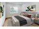 Bedroom with a king-size bed, hardwood floors, and neutral decor at 4675 Hickory Oak Dr, Brooksville, FL 34601