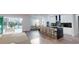 Modern kitchen with island, stainless steel appliances, and breakfast bar at 4675 Hickory Oak Dr, Brooksville, FL 34601