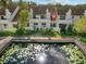 Townhome community with pond and lush landscaping, showcasing a desirable location at 5222 S Russell St # 25, Tampa, FL 33611