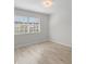 Well-lit bedroom featuring a large window and light flooring at 5222 S Russell St # 25, Tampa, FL 33611