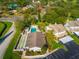 Beautiful aerial view showcasing the pool, shuffleboard, and well-maintained landscaping at 8019 Feather Ct # C, Hudson, FL 34667