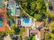 Aerial shot featuring the pool, shuffleboard, tennis and basketball courts at 8019 Feather Ct # C, Hudson, FL 34667