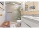 Bright bathroom featuring a glass-enclosed shower, vanity with sink, and tile flooring at 8019 Feather Ct # C, Hudson, FL 34667