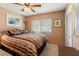 Cozy bedroom with a comfortable bed, window with blinds, closet, and soft lighting at 8019 Feather Ct # C, Hudson, FL 34667