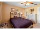 Inviting bedroom with a comfortable bed, dresser, and ample natural light from the window at 8019 Feather Ct # C, Hudson, FL 34667