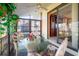 Cozy lanai with a glass table and comfortable seating, perfect for relaxing and enjoying the outdoors at 8019 Feather Ct # C, Hudson, FL 34667